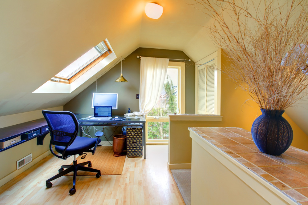 attic office space with blue decor