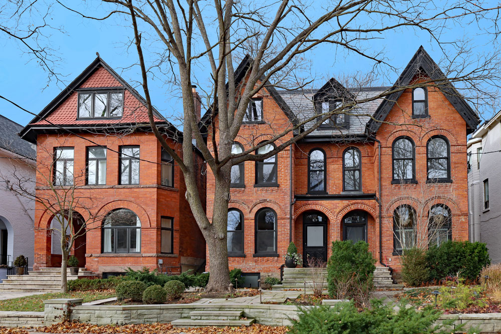 a row of victorian homes showing third floor living spaces